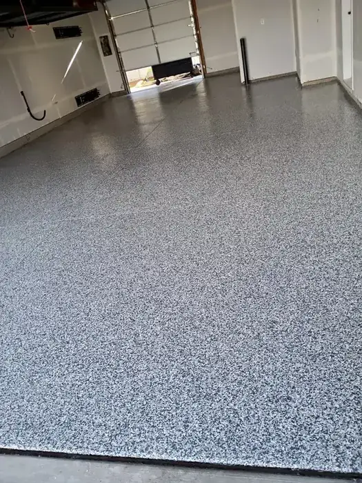 Finished interior space with polyaspartic floor coating in a light neutral color